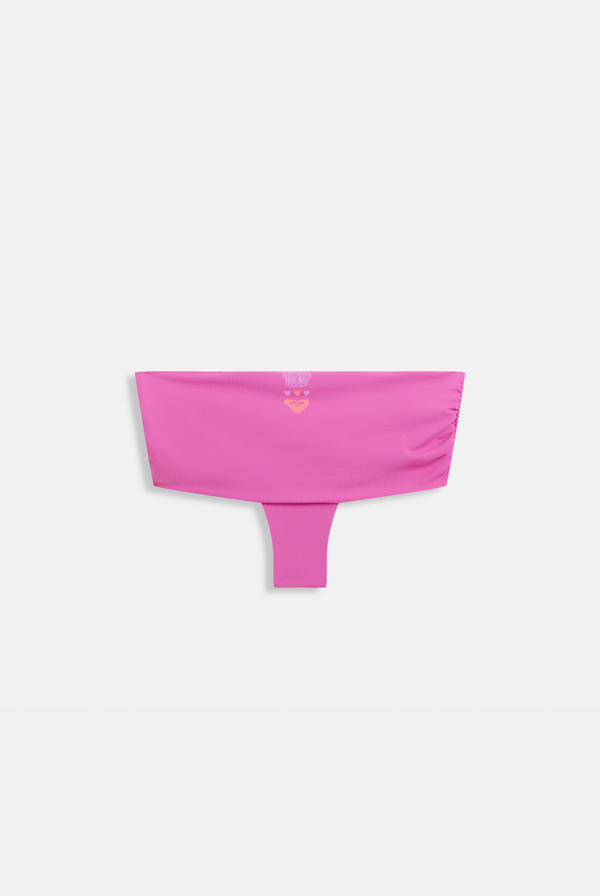Displays a model wearing the azalea pink Roxy and Couture cheeky bikini bottom 