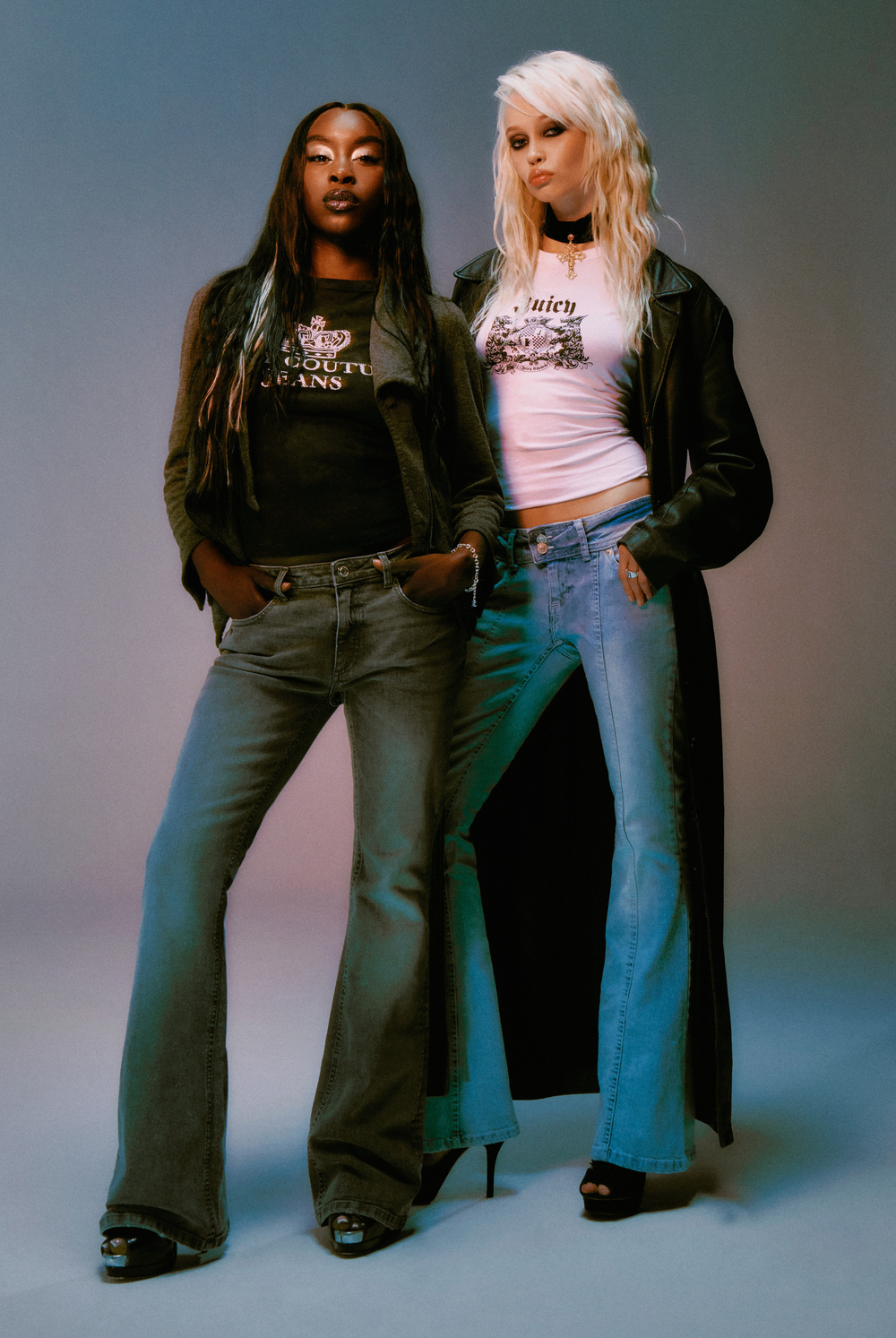 Displays a model wearing the Light wash 'juicy' branded low rise flared embodied jeans 