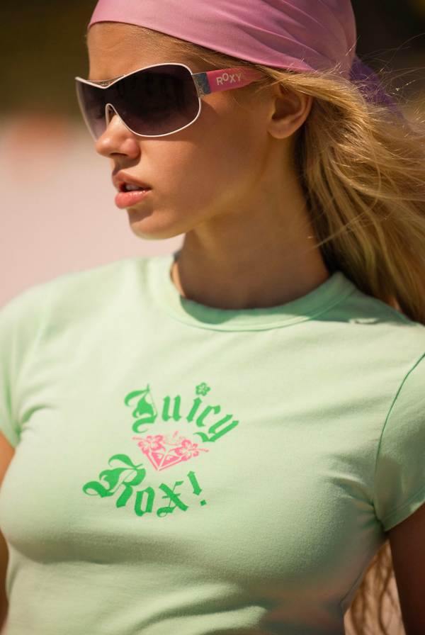 Displays a model wearing the Green Ash Roxy & Juicy couture baby tee 