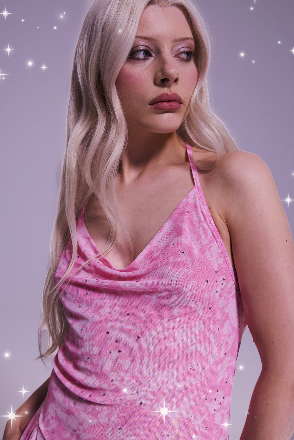 Displays a model wearing the Disney Begonia Pink 'Juicy' branded diamanté mesh halter dress 