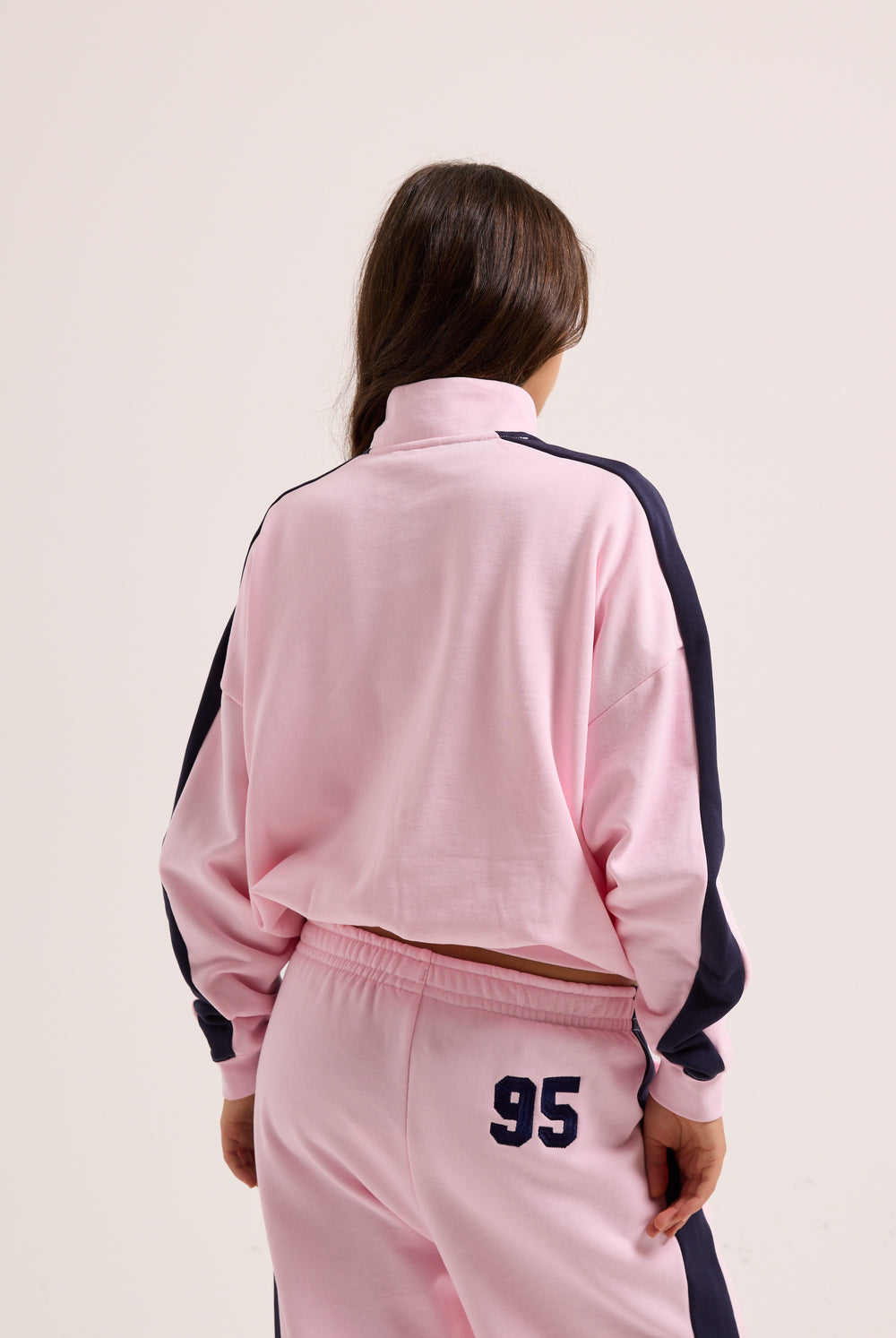 Displays the Cherry Blossom 'Juicy' branded college crest track top  