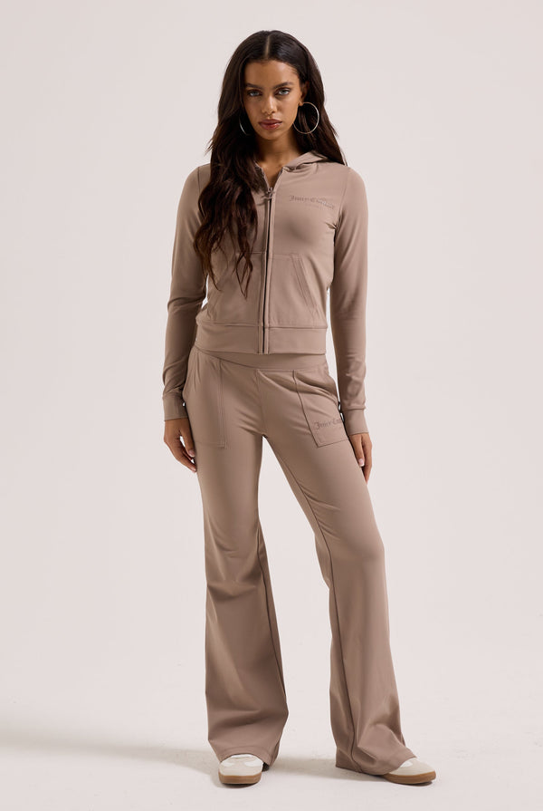Displays a model wearing the Fungi peached 'Juicy' branded active low rise pants 