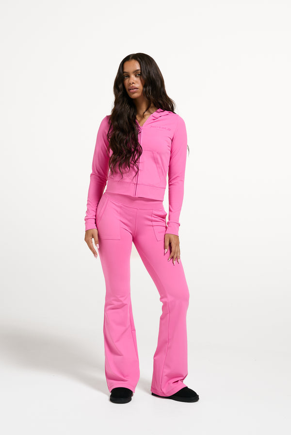 Displays a model wearing the Wild Orchid 'Juicy' branded Active Fitted Hoodie
