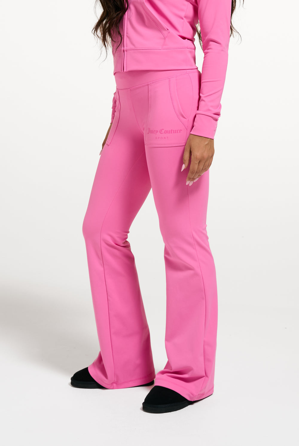 Displays a model wearing the Wild Orchid 'Juicy' branded active Low Rise Pant