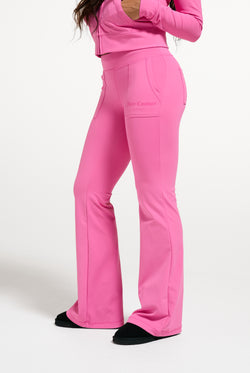 Displays a model wearing the Wild Orchid 'Juicy' branded active Low Rise Pant