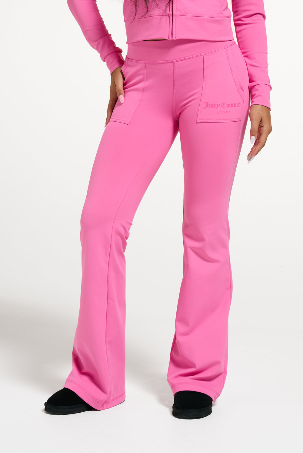 Displays a model wearing the Wild Orchid 'Juicy' branded active Low Rise Pant