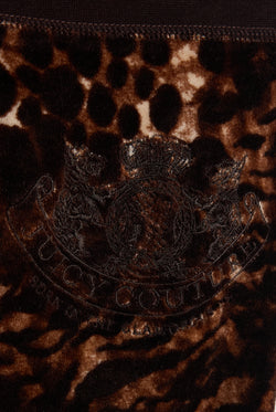 Displays a Java 'Juicy' branded Abstract Animal Caisa Trackpant featuring the juicy couture branding 