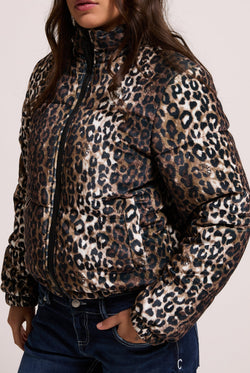 Displays a model wearing the leopard print velour 'Juicy' branded puffa jacket