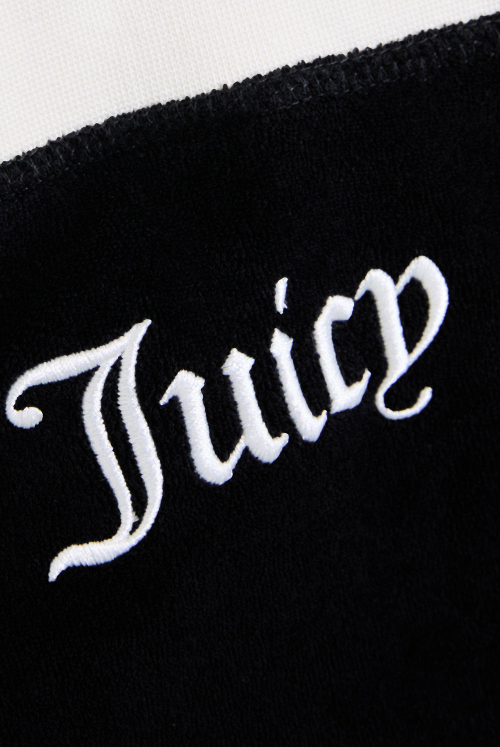 Displays the Black contrast 'Juicy' branding Terry bandeau featuring the juicy branding 