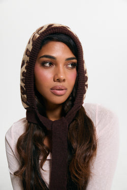 Displays a model wearing the Leopard Print 'Juicy' branded Bonnet With Bow