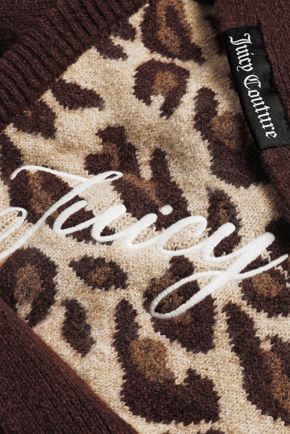 Displays the Leopard Print 'Juicy' branded Bonnet With Bow featuring the juicy branding 