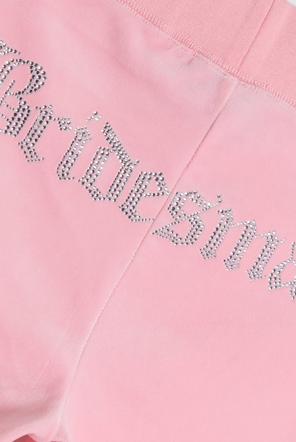 Displays the Juicy Pink 'Juicy' branded bridesmaid classic velour low rise track pants featuring the juicy branding 