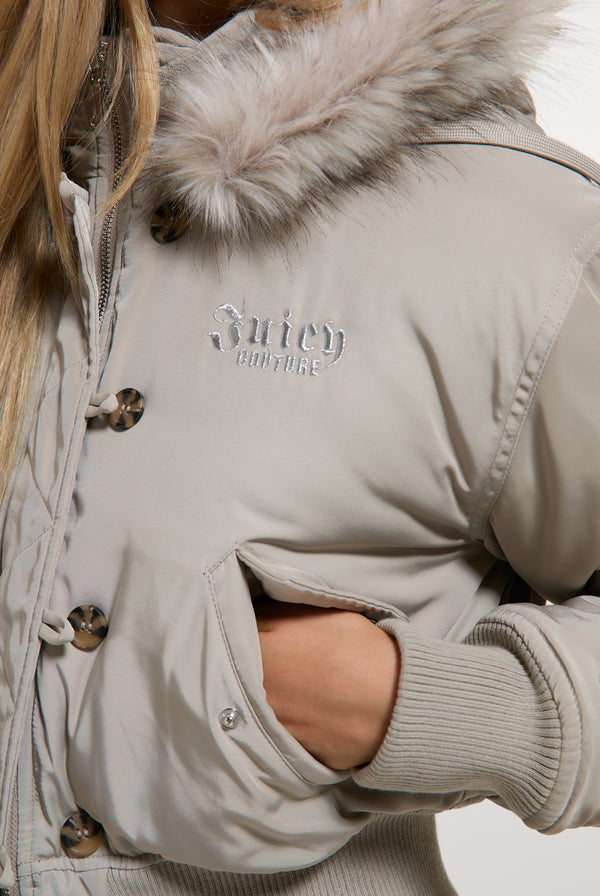 Displays a model wearing the String 'Juicy' branded Nylon Bomber