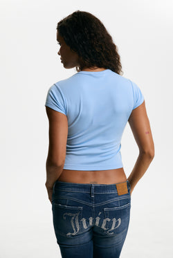 Displays a model wearing the Powder Blue 'Juicy' branded Script Diamante Baby Tee