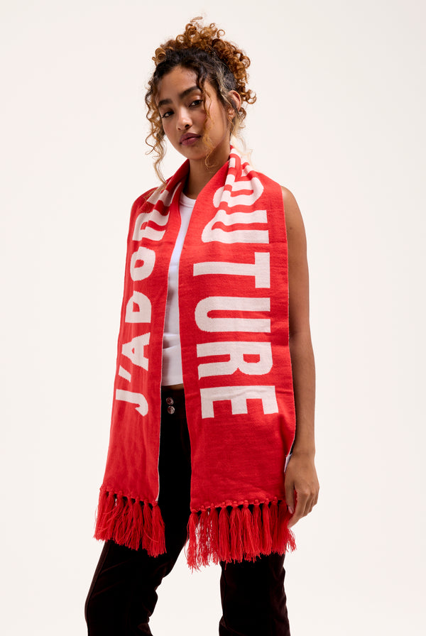 Displays a model wearing the Cream & Coral Contrast 'Juicy' branded football scarf 
