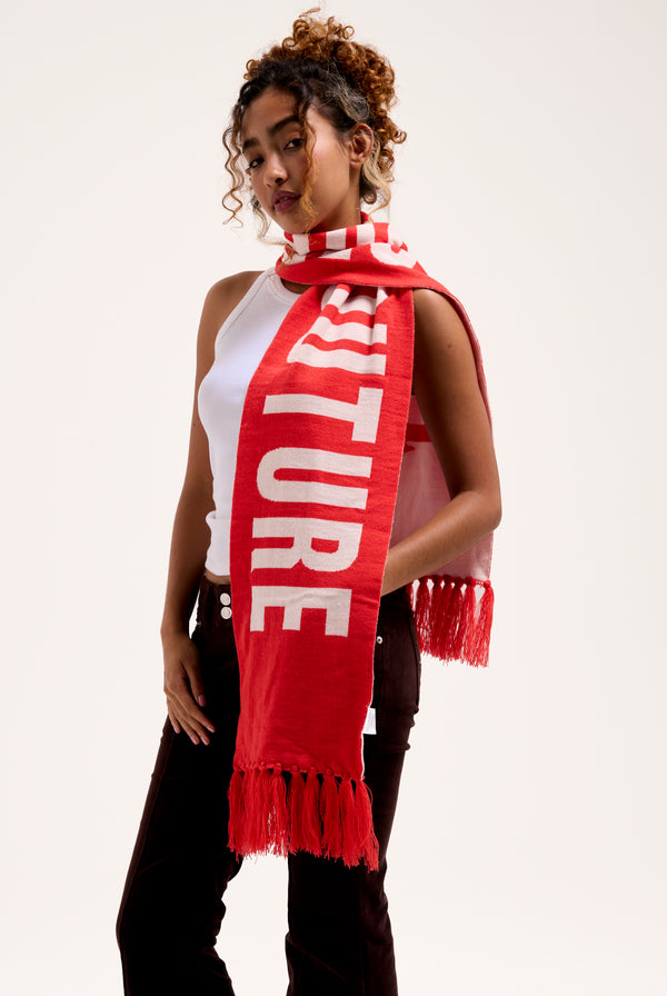 Displays a model wearing the Cream & Coral Contrast 'Juicy' branded football scarf 
