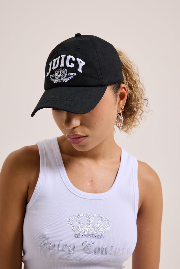 Displays a model wearing the Black 'juicy' branded crest embroidered cap 
