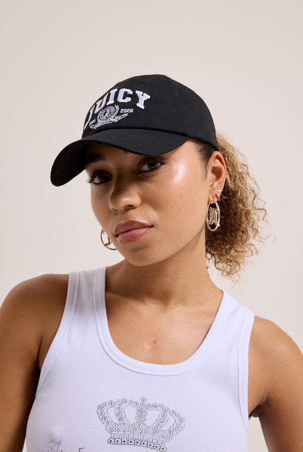 Displays a model wearing the Black 'juicy' branded crest embroidered cap 