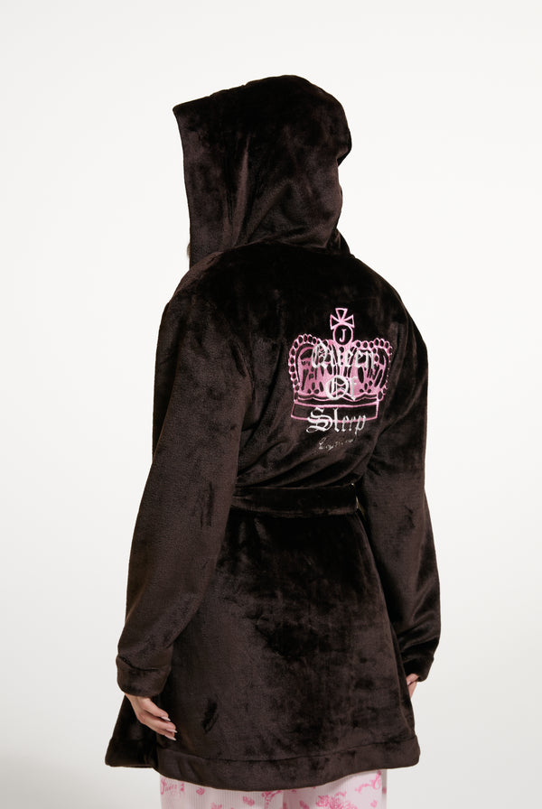 Displays a model wearing the Java 'Juicy' branded crown plush hooded robe 