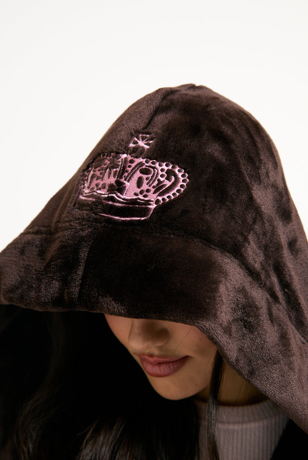 Displays a model wearing the Java 'Juicy' branded crown plush hooded robe 