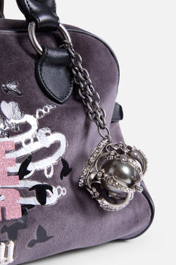 Displays the Rabbit 'Juicy' branded Bowling Daydreamer Bag featuring the details including the juicy branded charm 