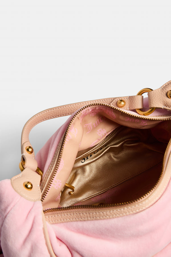 Displays the Juicy Pink 'Juicy' branded crest velour hobo bag 