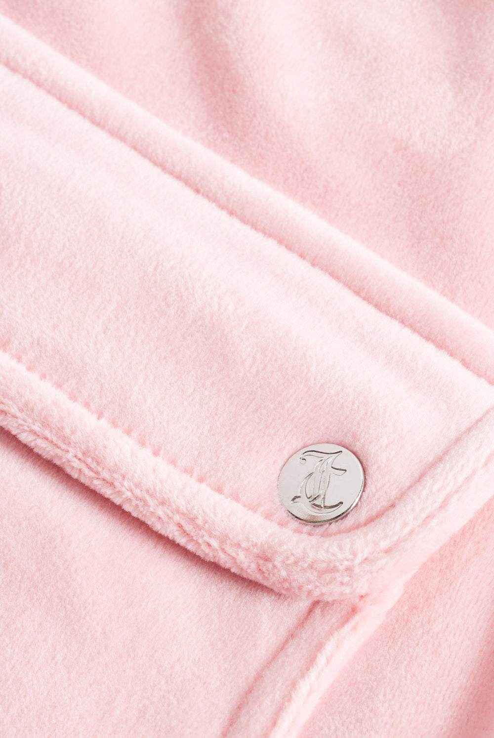 Displays the Juicy Pink Classic 'Juicy' branded velour del ray pocketed bottoms