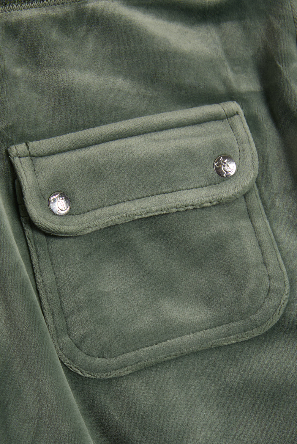 Displays the Thyme 'Juicy' branded classic velour del ray pocketed bottoms featuring the pockets  
