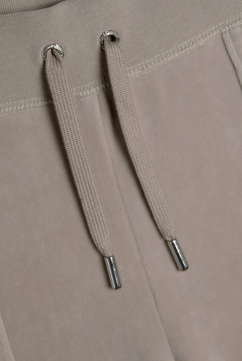 Displays the String 'Juicy' branded classic velour del ray pocketed bottoms 