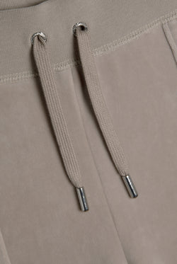 Displays the String 'Juicy' branded classic velour del ray pocketed bottoms 