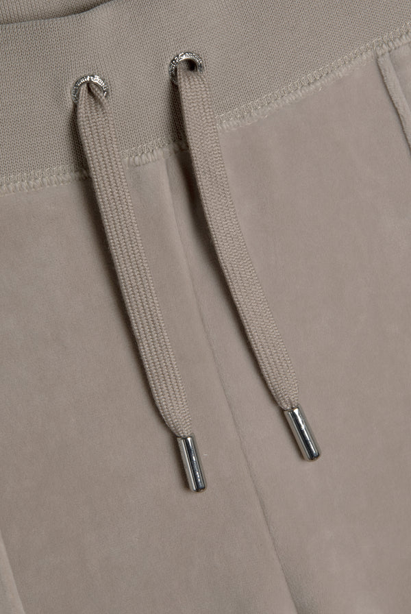 Displays the String 'Juicy' branded classic velour del ray pocketed bottoms 