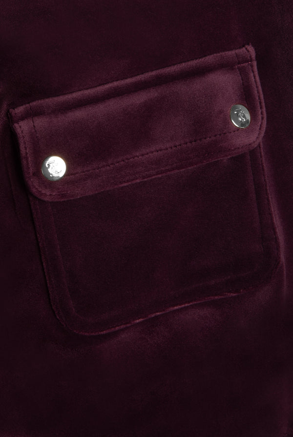 Displays the Wine-tasting classic 'juicy' branded velour del ray pocketed 