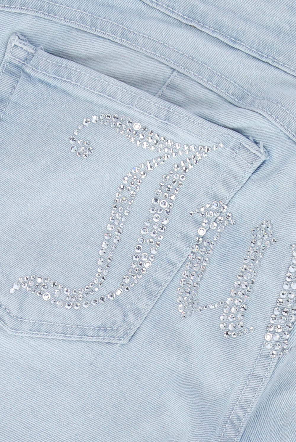 Displays the Bleached Demin 'Juicy' couture low rise flare diamanté jeans featuring the juicy branding 