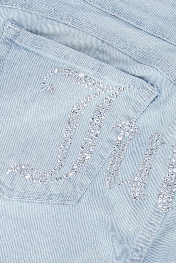 Displays the Bleached Demin 'Juicy' couture low rise flare diamanté jeans featuring the juicy branding 
