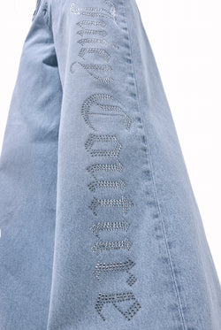 Displays the Light Wash Diamanté 'Juicy' branded wide leg jeans 