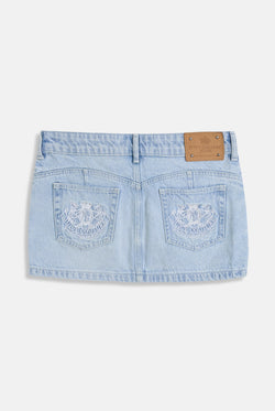 Displays the Light Wash 'Juicy' branded denim dog crest mini skirt 