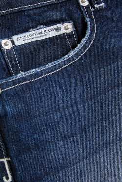 Displays the Mid Wash 'Juicy' branded dog crest mini skirt