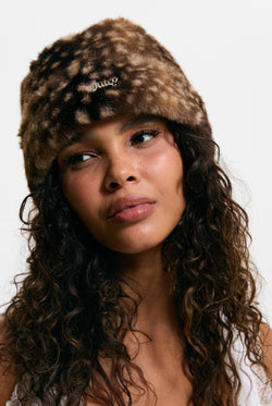 Displays a model wearing the Bambi Print 'Juicy' branded Faux Fur Hat