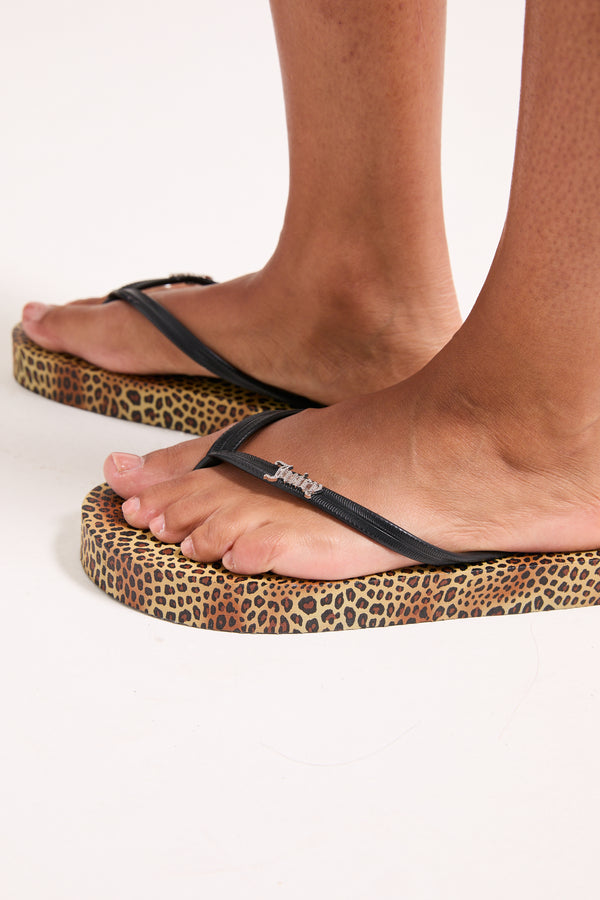 Displays the Leopard Print 'Juicy' branded platform flip flop 