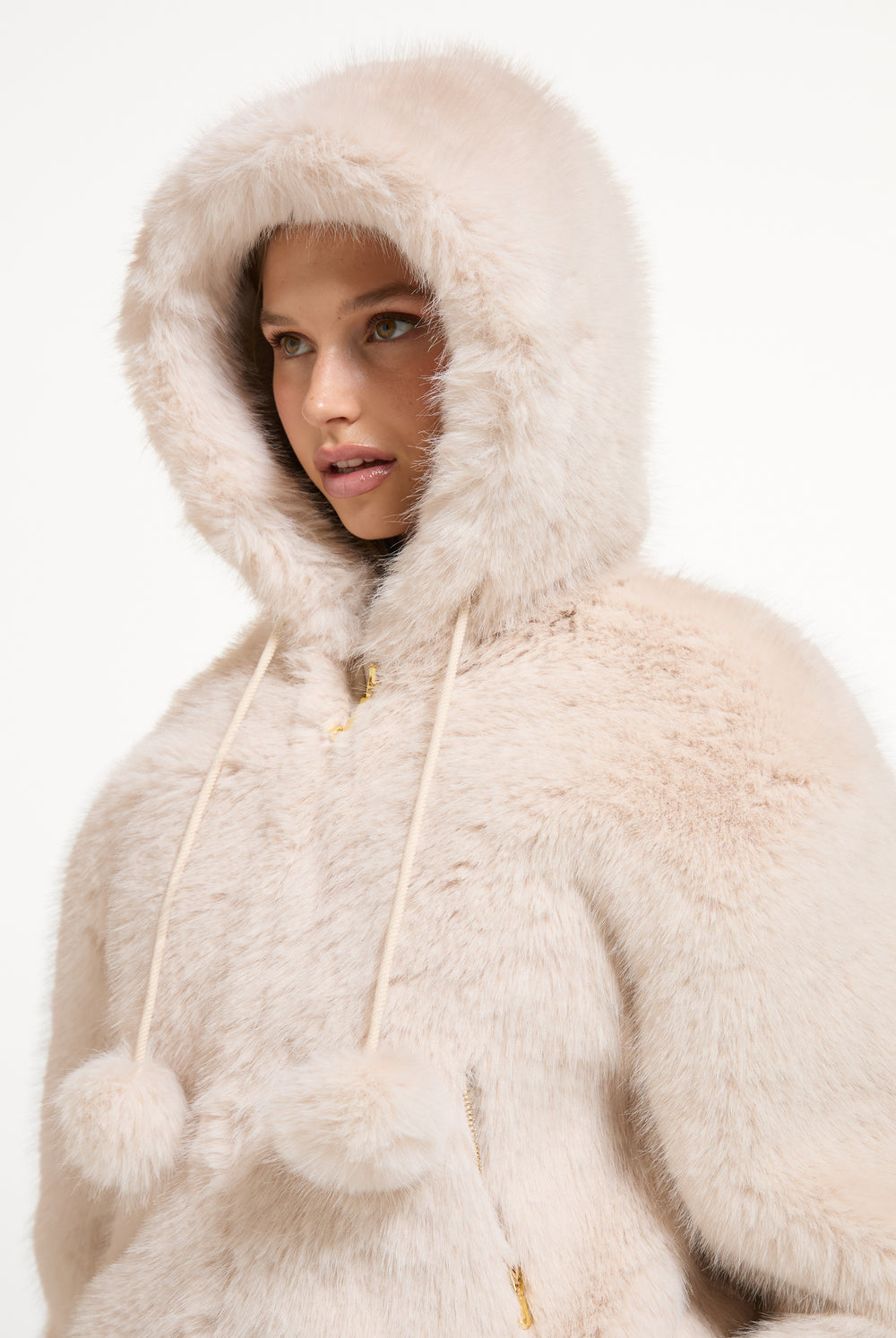Displays a model wearing the Natural 'Juicy' branded Fur Hooded Faux Fur Jacket