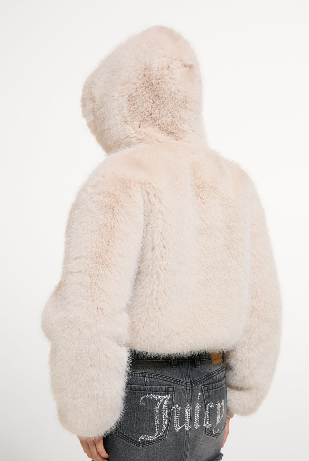 Displays a model wearing the Natural 'Juicy' branded Fur Hooded Faux Fur Jacket