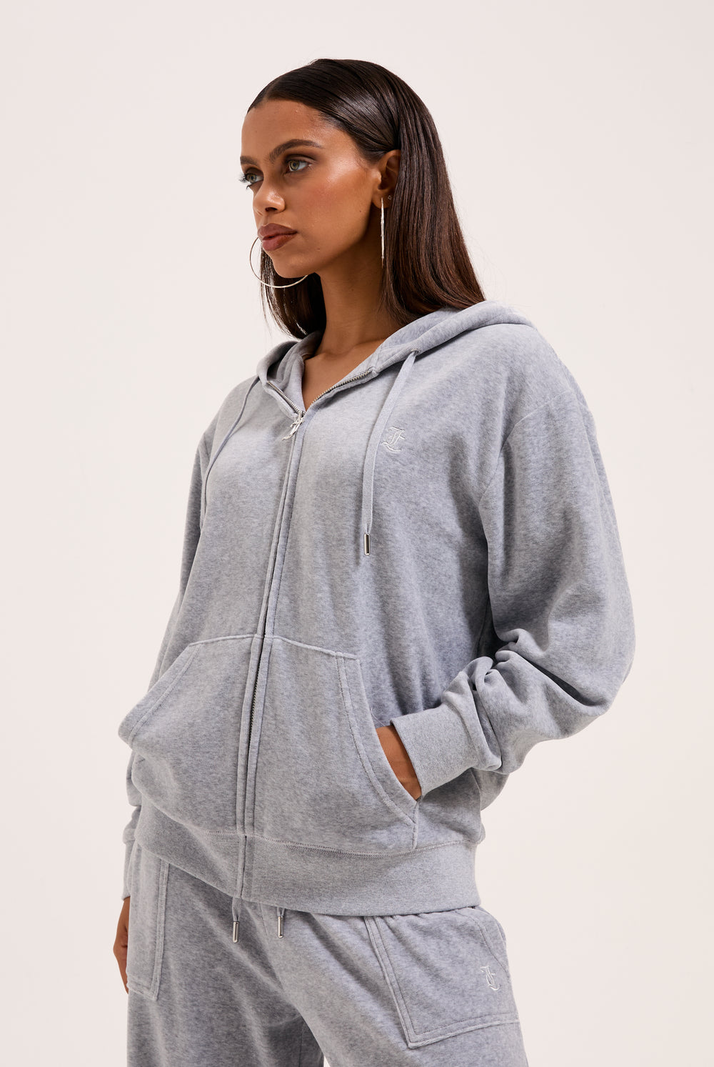 Displays a model wearing the Silver Marl 'Juicy' branded Cotton velour oversized hoodie