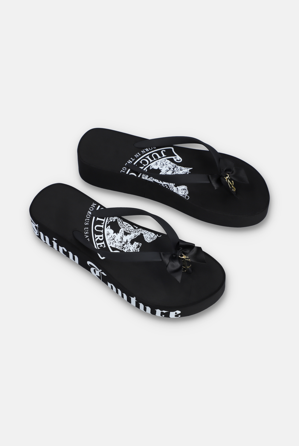 Displays a pair of the Black Heritage 'Juicy' branded wedge slides