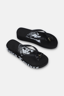 Displays a pair of the Black Heritage 'Juicy' branded wedge slides