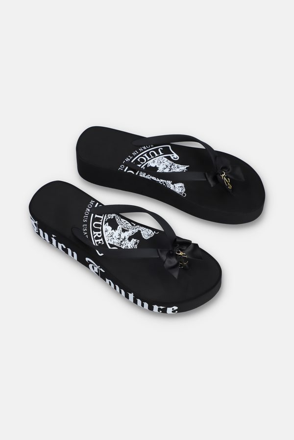 Displays a pair of the Black Heritage 'Juicy' branded wedge slides