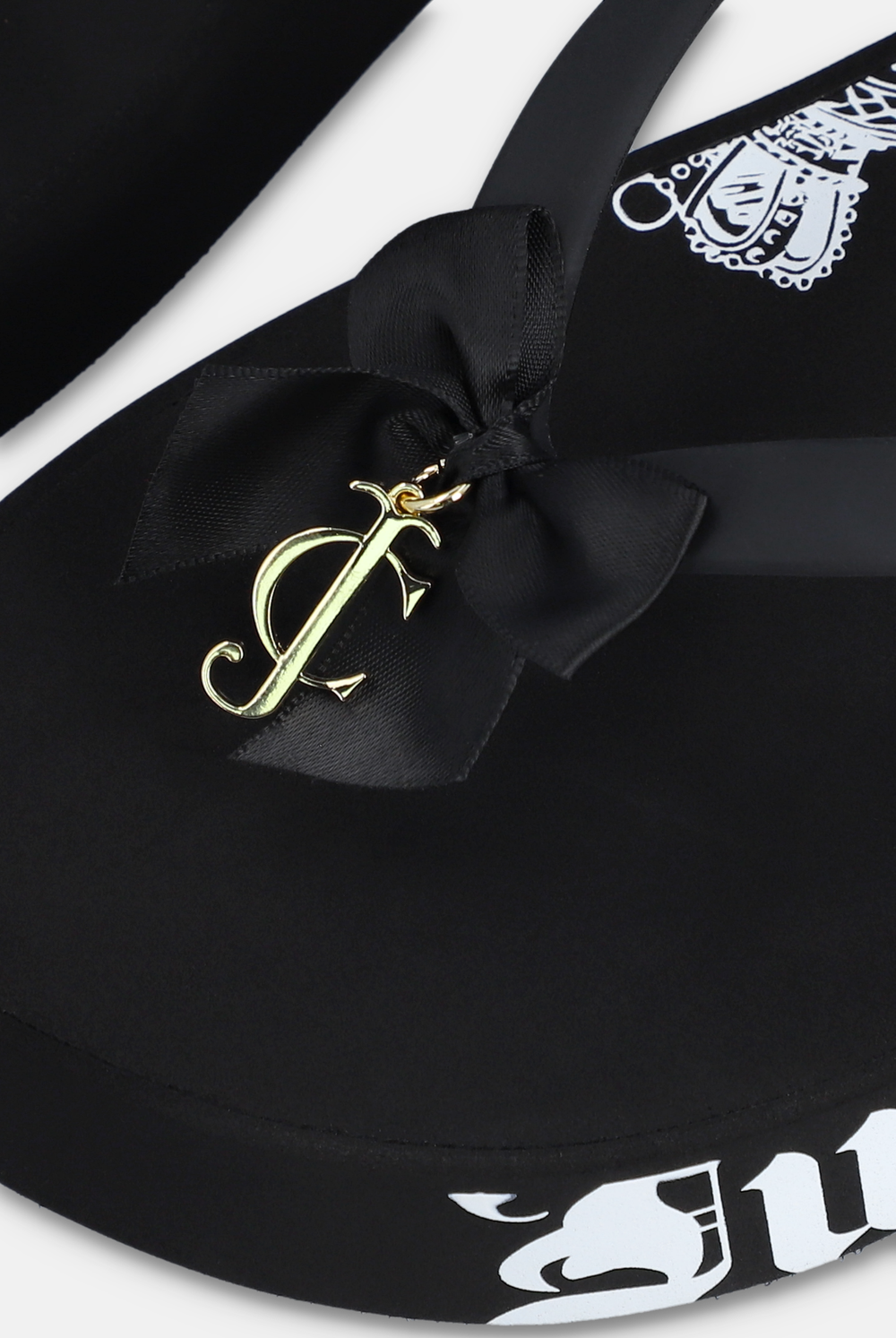 Displays the Black Heritage 'Juicy' branded wedge slide
