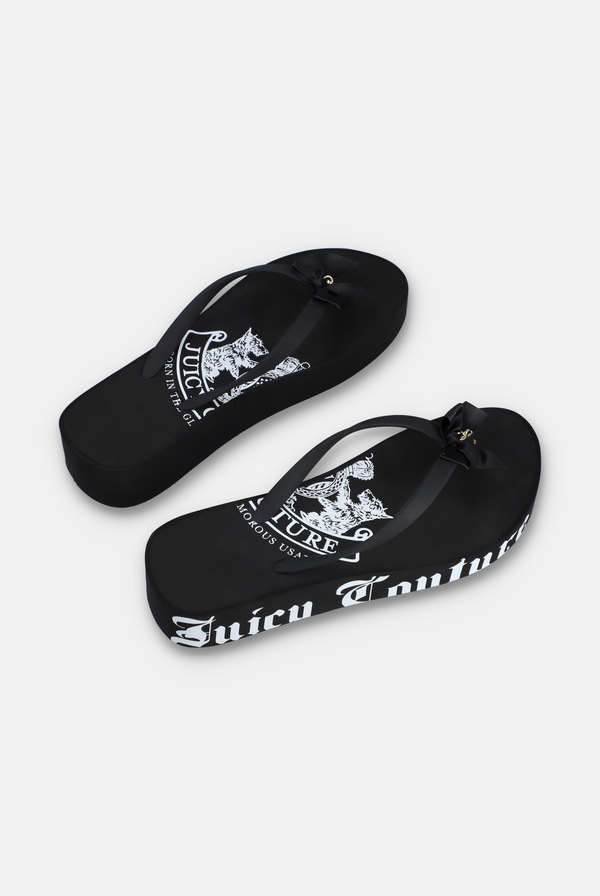 Displays a pair of the Black Heritage 'Juicy' branded wedge slides