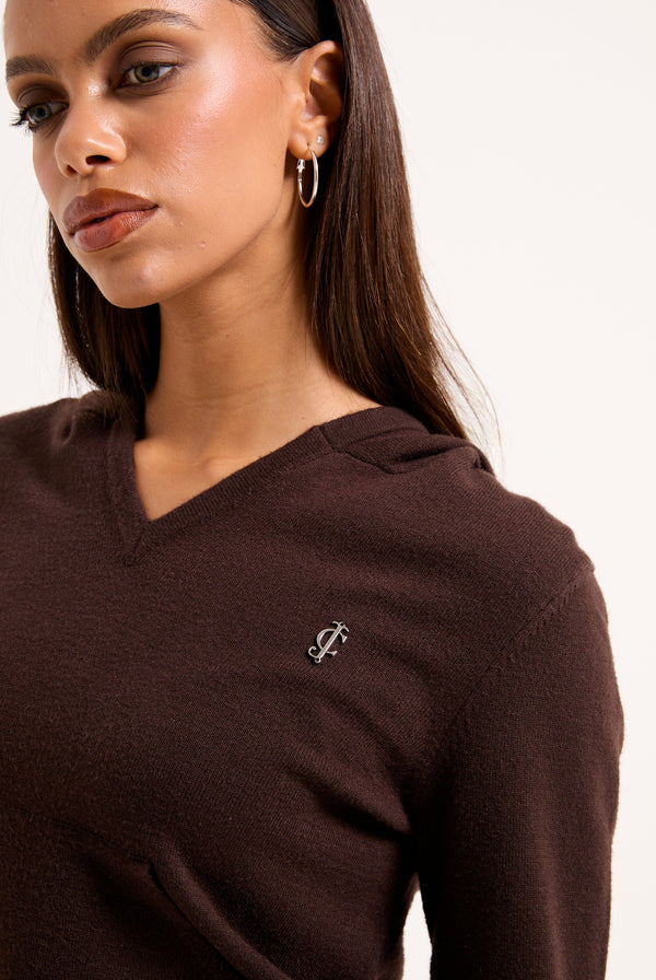 Displays a model wearing the Java 'juicy' branded heritage knit hoodie 
