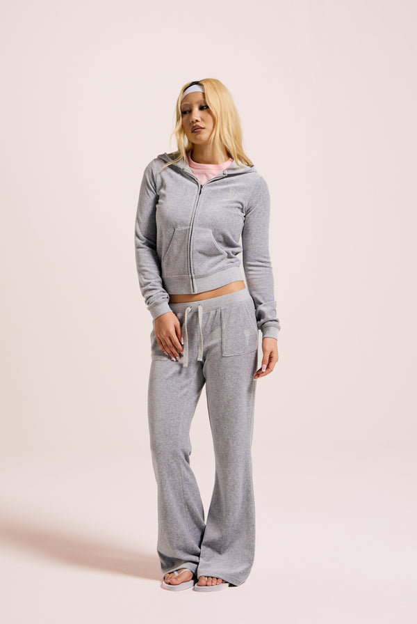 Displays a model wearing the Silver Marl 'Juicy' branded bamboo velour heritage hoodie 