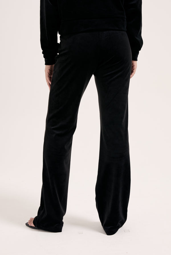Displays the Black outline 'Juicy' branded diamanté classic velour low rise pant 